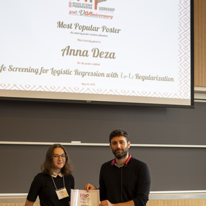 Yuri Faenza (MIP 2022 PC Chair) with Most Popular Poster (as voted by the workshop participants) awardee Anna Deza
