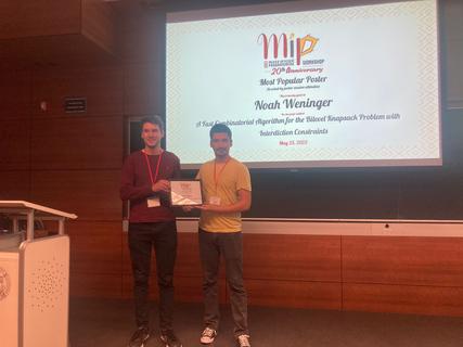 Gonzalo Muñoz (MIP 2023 PC chair) with Most Popular Poster awardee Noah Weninger