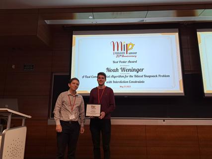 Thiago Serra (Poster Competition jury Chair) with Best Poster awardee Noah Weninger